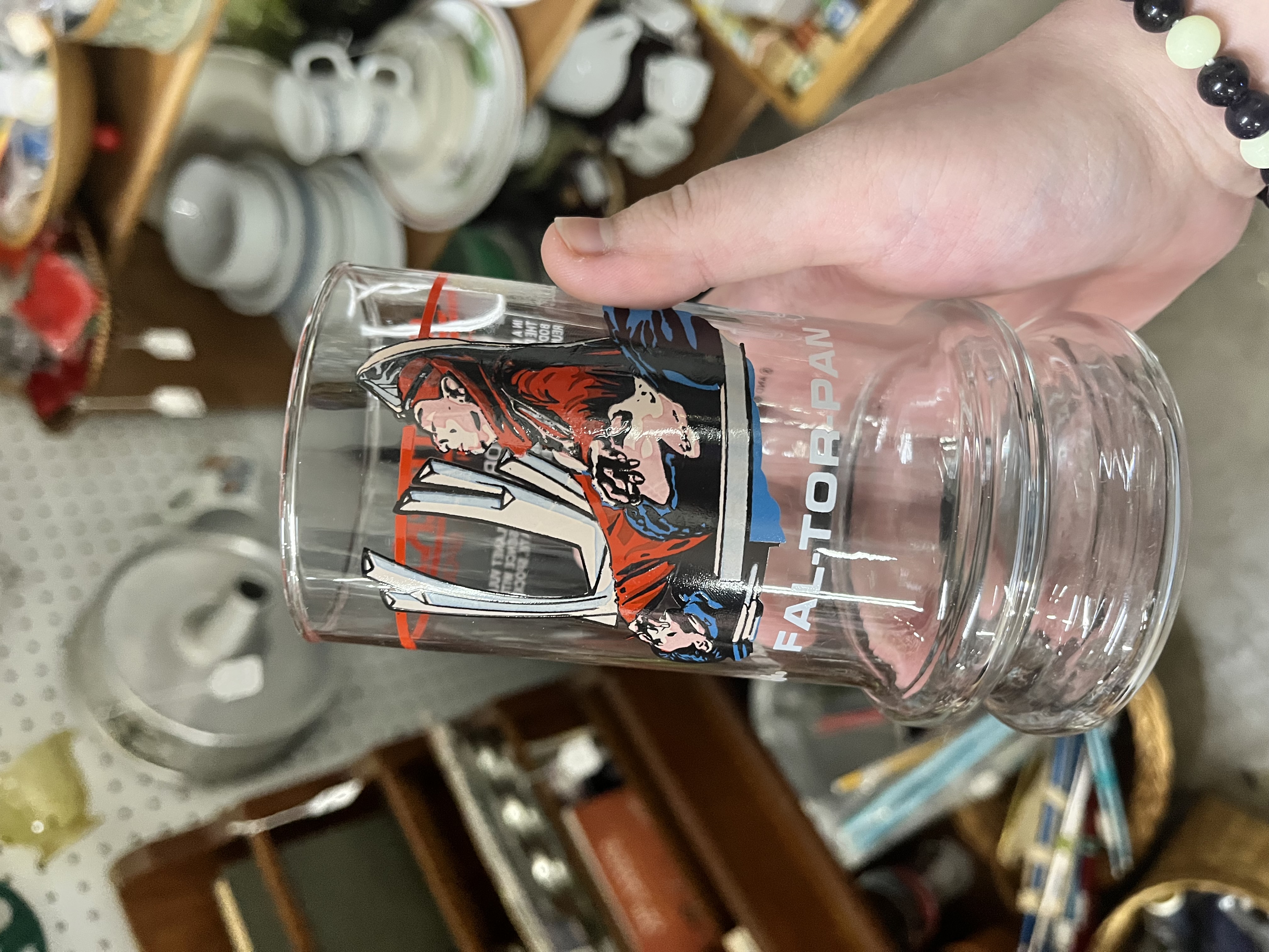 Star Trek "The Search for Spock" Taco Bell limited-edition glass cup held at an antique mall - comic-book-style art of Spock and crew wraps around the clear glass